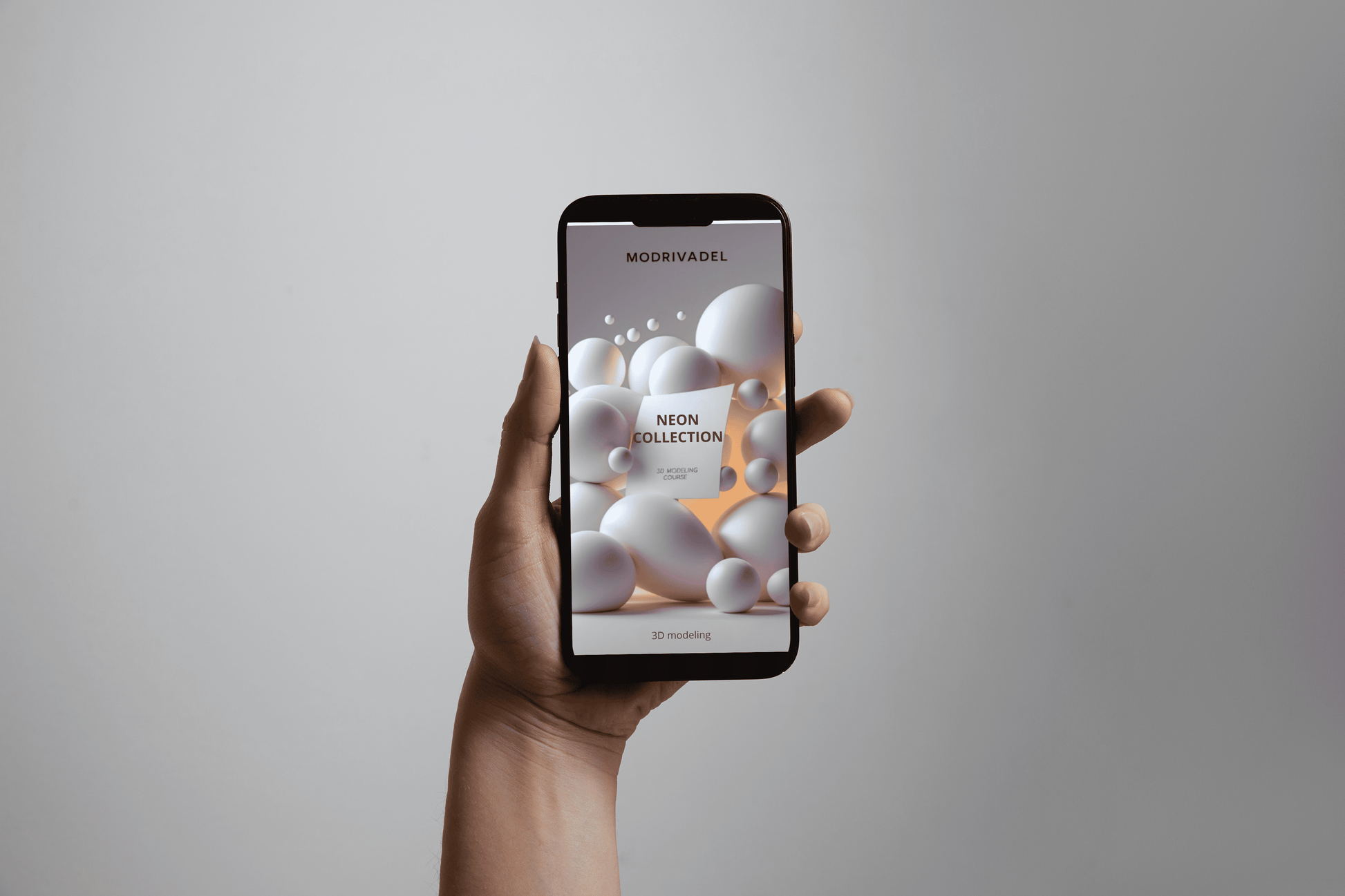 Hand holding a smartphone with a product display app on a gray background